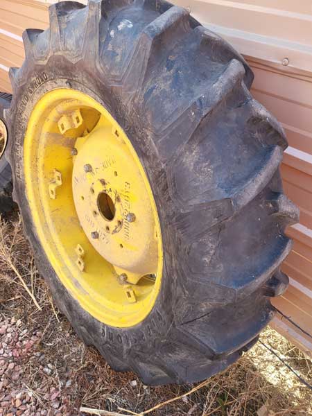 Used - 12.4 x 28 Firestone tractor tires, two tires with John Deere and Yanmar wheels and wheel weights --- $1400/pair 