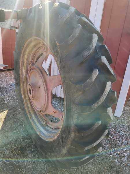 Used - 13.6 x 38 tractor tire, single tire, almost new, (on a Farmall H rim and center) --- $800